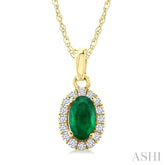 5x3 MM Oval Shape Emerald and 1/20 Ctw Round Cut Diamond Halo Precious Pendant with Chain in 14K Yellow Gold