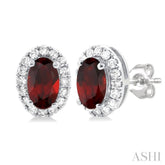 5x3 MM Oval Shape Garnet and 1/8 Ctw Round Cut Diamond Halo Semi-Precious Stud Earrings in 10K White Gold