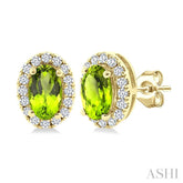5x3 MM Oval Shape Peridot and 1/8 Ctw Round Cut Diamond Halo Semi-Precious Stud Earrings in 14K Yellow Gold