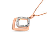 Diamond 1/8 Ct.Tw. Round and Baguette Fashion Pendant in 14K Two Tone Gold