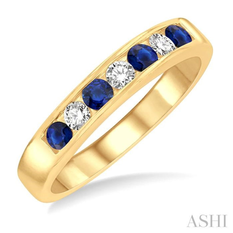 2.5 MM Round Cut Sapphire and 1/5 Ctw Channel Set Round Cut Diamond Band in 14K Yellow Gold 2.5 MM Round Cut Sapphire and 1/5 Ctw Channel Set Round Cut Diamond Band in 14K Yellow Gold