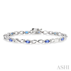 4x3mm Oval Cut Tanzanite and 1/10 ctw Single Cut Diamond Bracelet in 10K White Gold