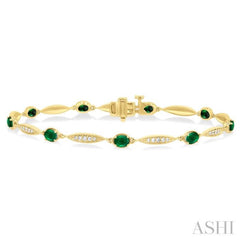 4X3 MM Oval Cut Emerald and 1/4 ctw Round Cut Diamond Precious Bracelet in 10K Yellow Gold