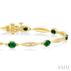 4X3 MM Oval Cut Emerald and 1/4 ctw Round Cut Diamond Precious Bracelet in 10K Yellow Gold