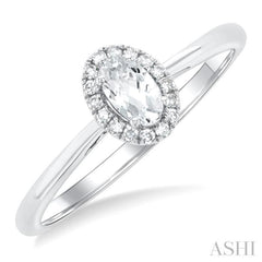 5x3 MM Oval Shape White Topaz and 1/20 Ctw Single Cut Diamond Halo Semi-Precious Ring in 10K White Gold