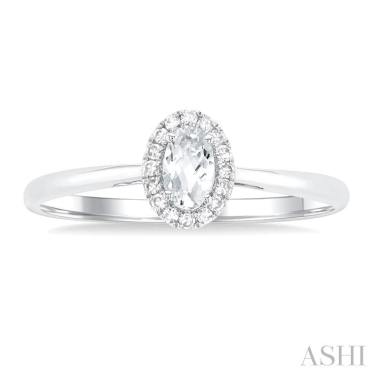 5x3 MM Oval Shape White Topaz and 1/20 Ctw Single Cut Diamond Halo Semi-Precious Ring in 10K White Gold