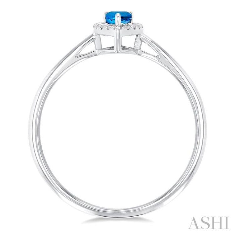5x3 MM Pear Shape Blue Topaz and 1/20 Ctw Single Cut Diamond Halo Semi-Precious Ring in 14K White Gold