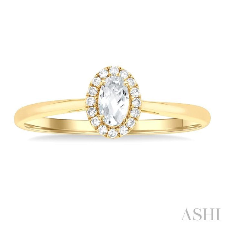 5x3 MM Oval Shape White Topaz and 1/20 Ctw Single Cut Diamond Halo Semi-Precious Ring in 10K Yellow Gold