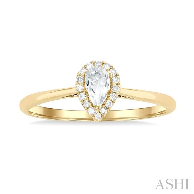 5x3 MM Pear Shape White Topaz and 1/20 Ctw Single Cut Diamond Halo Semi-Precious Ring in 10K Yellow Gold