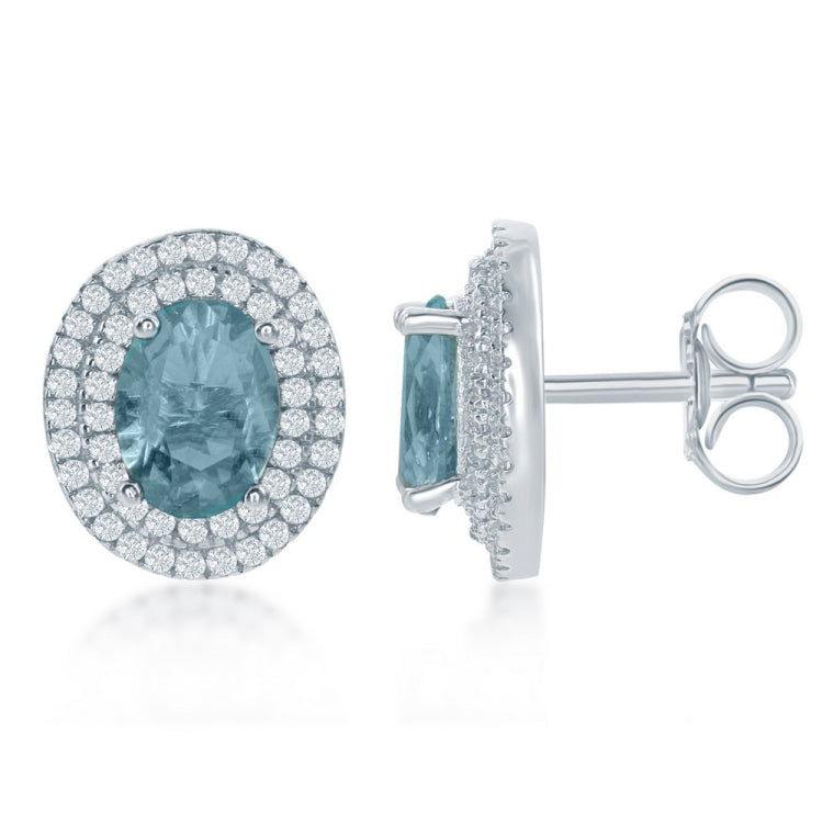 Sterling Silver Oval Simulated Blue Topaz with CZ Border Earrings