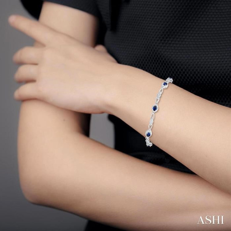1/20 Ctw Oval Cut 4X3MM Sapphire and Round Cut Diamond Precious Fashion Bracelet in 10K White Gold